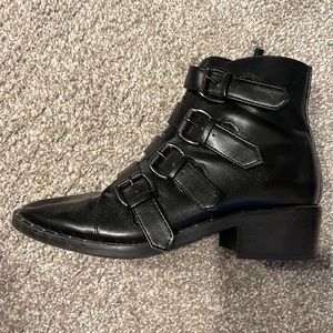 Black booties with buckle details